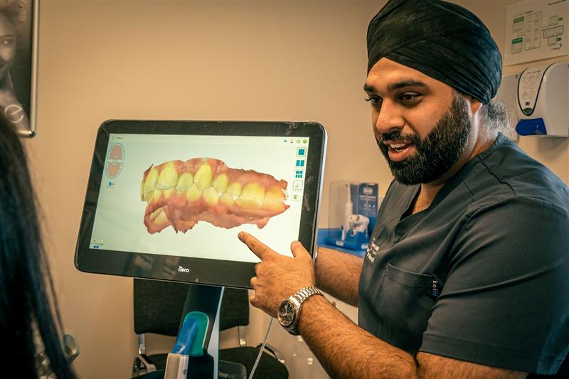 Dentist showcasing scan to the patient